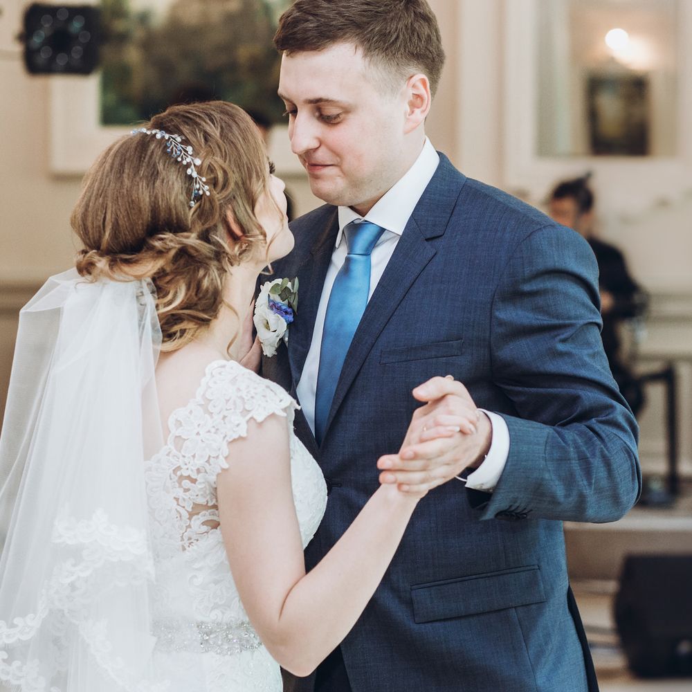 Bride and groom sharing their first dance at an elegant wedding reception